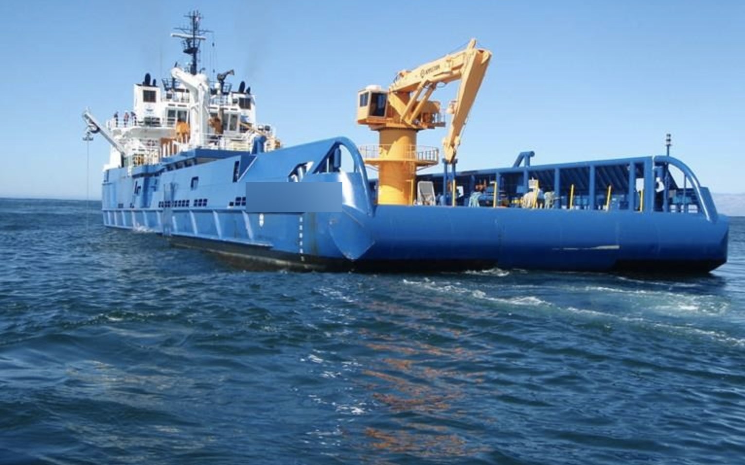 Project Nanuq — ice-class platform underway, open working deck and knuckle-boom crane