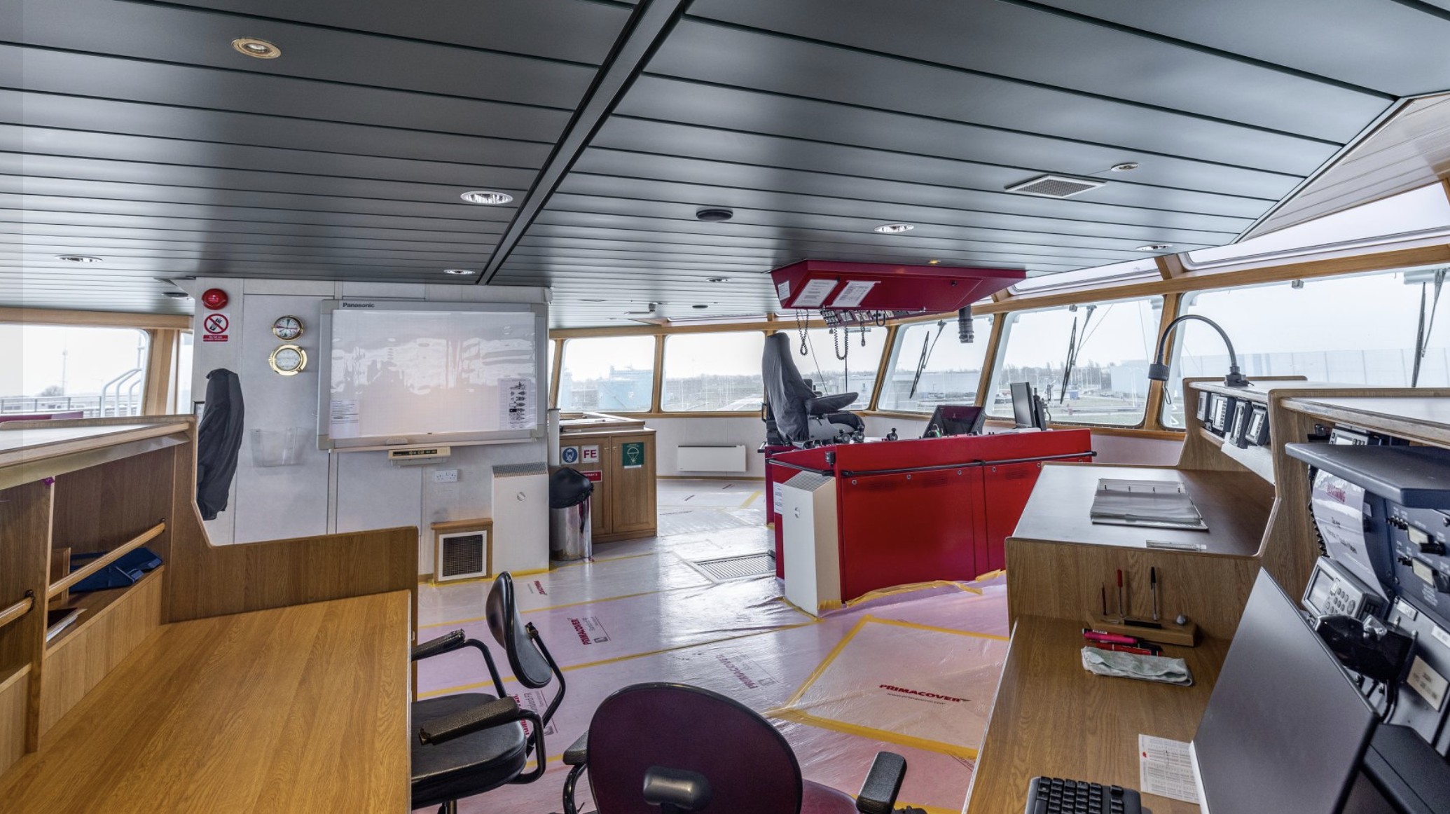 Project Vega — wheelhouse / bridge, wood-trimmed and ready for conversion